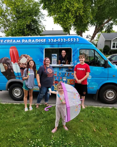 Happy family with children enjoying ice cream from Ice Cream Paradise truck