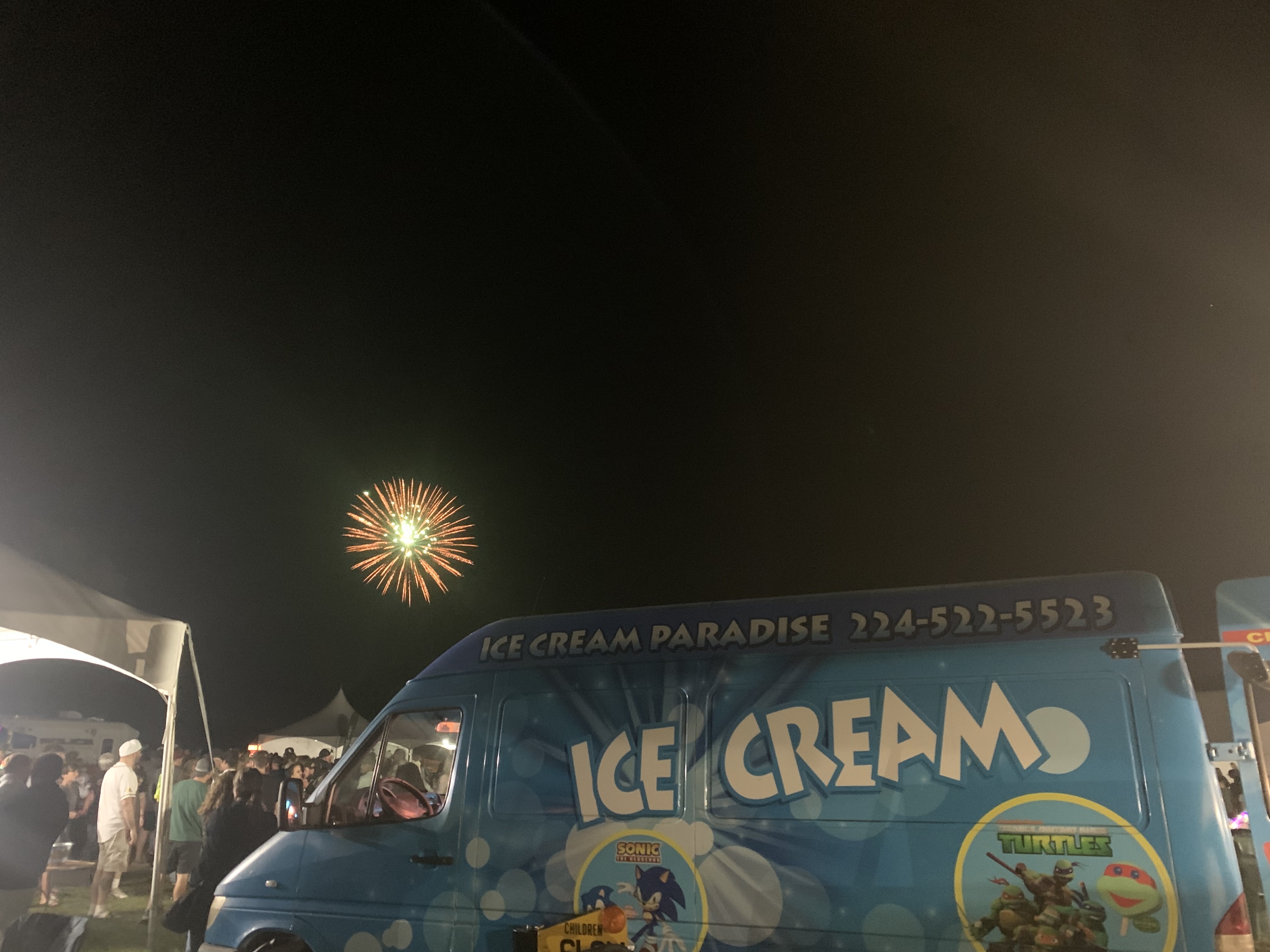 Ice Cream Paradise truck at a busy outdoor event